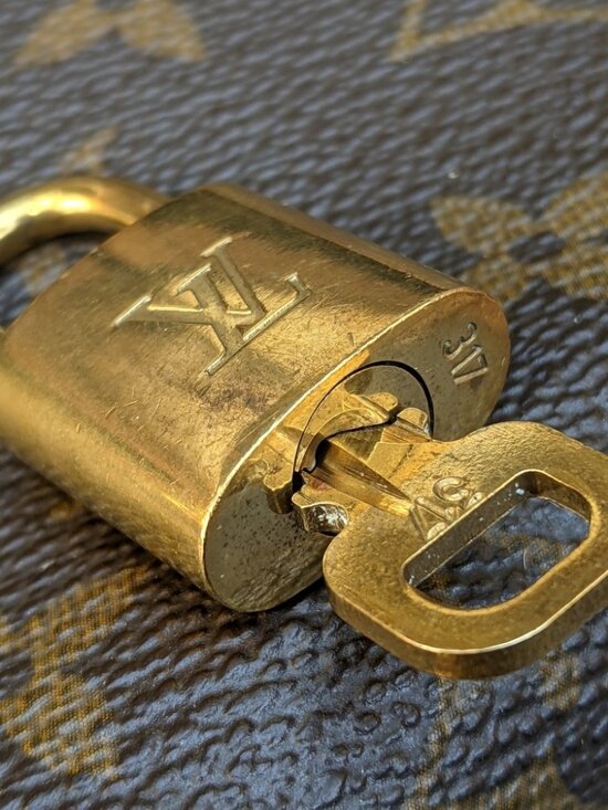 Louis Vuitton Handbags - Authentic Louis Vuitton padlock key and lock set